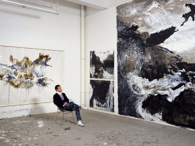 Artist Shen Wei in his studio amid his large-scale abstract paintings