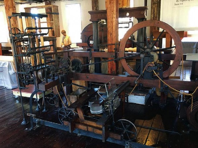 View of early mill machinery constructed of wood and metal