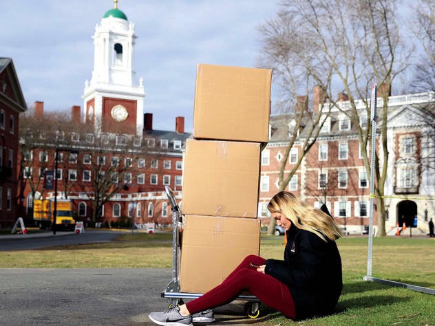 Photograph of student moving out of Eliot House for coronavirus social distancing