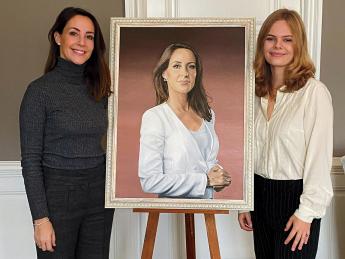 Princess Marie and Jensen pose beside Jensen's finished portrait of the princess 