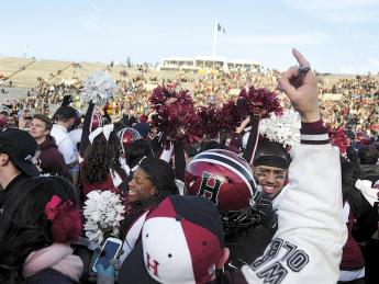 Harvard followers stormed the field at Yale Bowl to join players celebrating the Crimson&rsquo;s seventh straight victory over the Blue. 