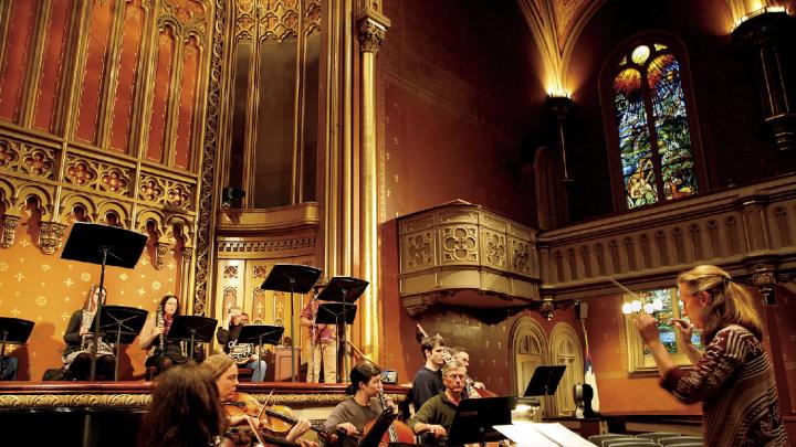 Sara Jobin conducts a rehearsal of <i>Purchase of Manhattan,</i> which premiered at the Marble Collegiate Church in November.