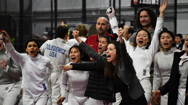 Coaches and members of Harvard's women's fencing team celebrate