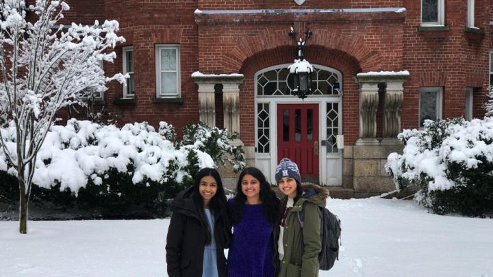 The author and her two roommates stand in the snow in front of their future home at Harvard.