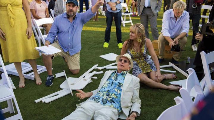 Schaffer directs a “Curb Your Enthusiasm” scene in which David lies on the ground surrounded by other cast members.