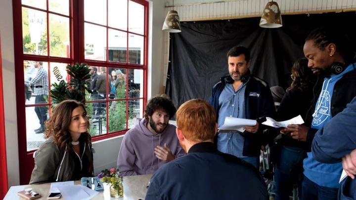 Schaffer works on a scene with star Dave Burd (second from left) and other cast members from “Dave.”